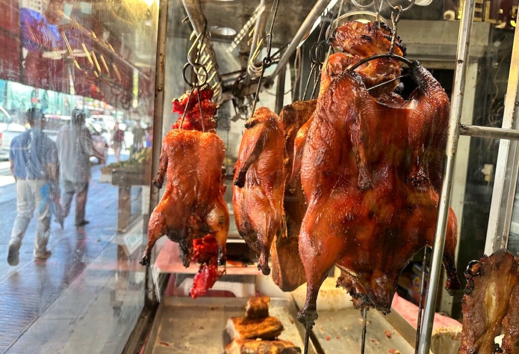 Roast Ducks hanging in a window