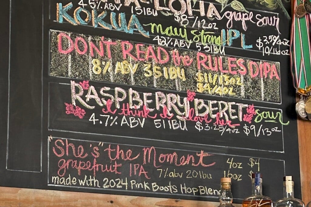 chalkboard sign listing Pink Boots Society Benefit Beers
