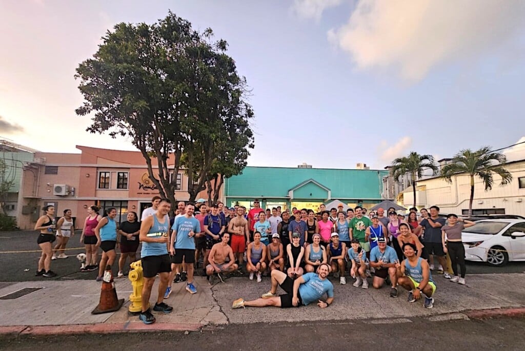 members of one of honolulu's run clubs pose for a group photo in front of brewery