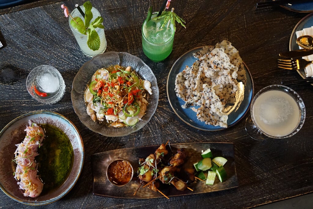 Assortment of vibrant southeast asian dishes at a modern restaurant
