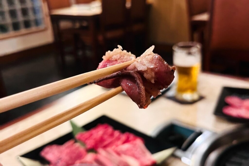 chopsticks holding grilled Beef Tongue I